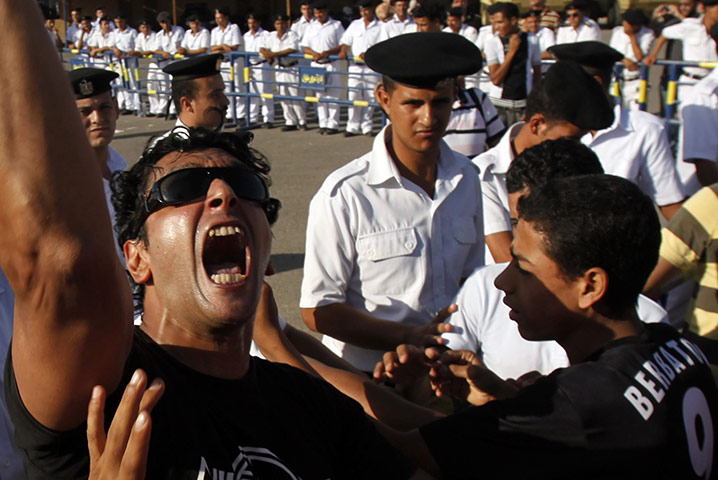 Mubarak in court: A protester shouts slogans against Mubarak  in Cairo