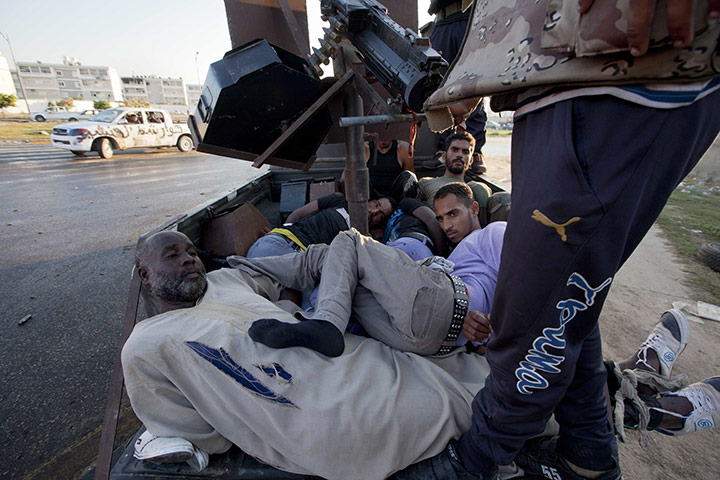 Sean Smith in Libya: 25 August: Rebel fighters take prisoners away from fighting in Abu Salim