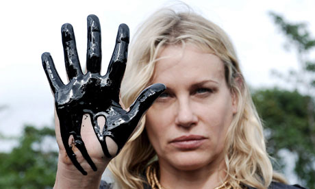 US actress Daryl Hannah shows her oilcontaminated hand