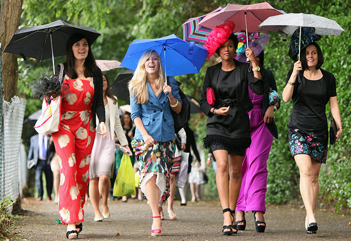 Summer 2011: Ascot:  Racegoers arrive in the pouring rain on Ladies Day at Royal Ascot