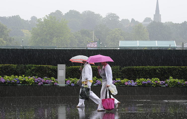 Summer 2011: London: A huge downpour stops play mid-afternoon at Wimbledon