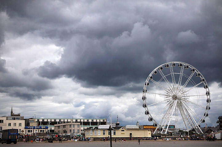 24 hours in pictures: Weston-super-mare, England: Rain clouds gather on the seafront
