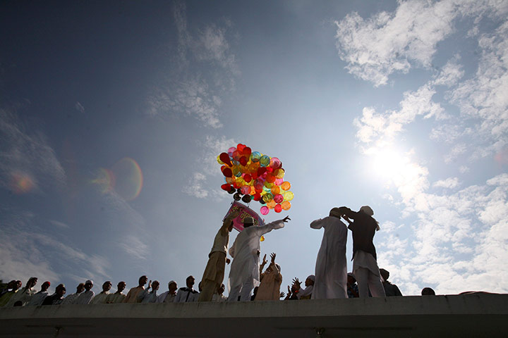 Eid al-Fitr: Kathmandu, Nepal: Revellers release balloons that read 'Happy Eid'