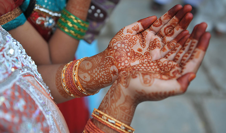 Eid al-Fitr: Hyderabad, India: An Indian Muslims girl holds out her decorated hands