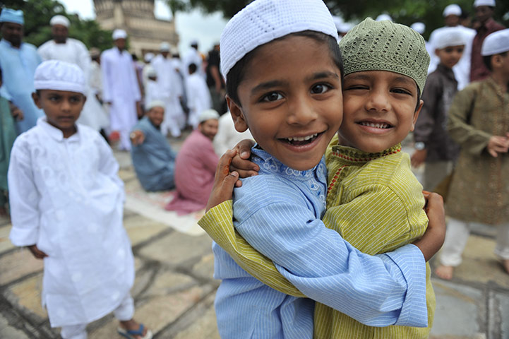 Eid al-Fitr: Hyderabad, India: Muslim children greet one another after Eid prayers