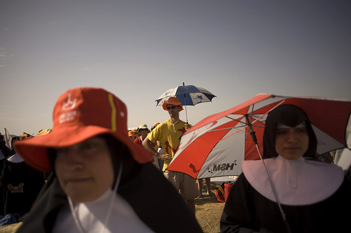 FTA: Jorge Guerrero: Pilgrims attend a mass celebrated by the Pope at Cuatro Vientos