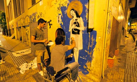 Graffiti artist Bleeps.GR at work in Athens