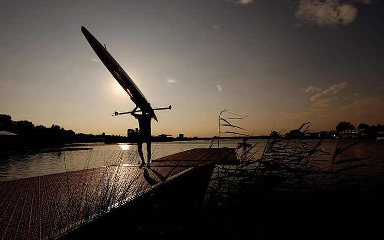 24 Hours : Windsor, England: A competitor carries his canoe and oars after a practice
