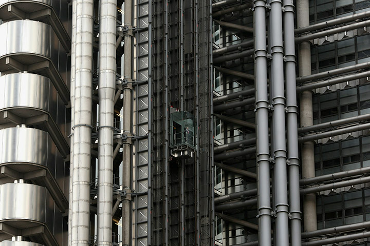 A worker uses the lift in the Lloyd's of London building
