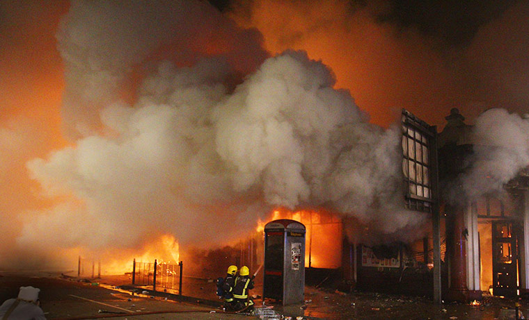 Tottenham riots: Fire fighters attempt to put out a blaze 
