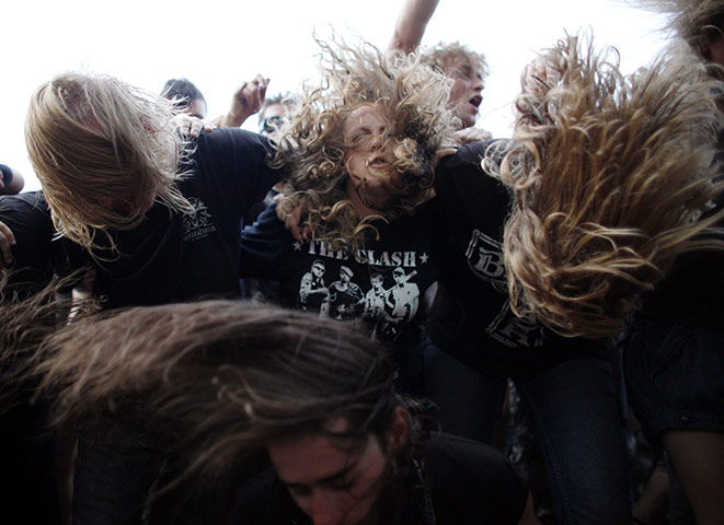 24 hours in pictures: Heavy metal fans head bang at the Woodstock Festival 