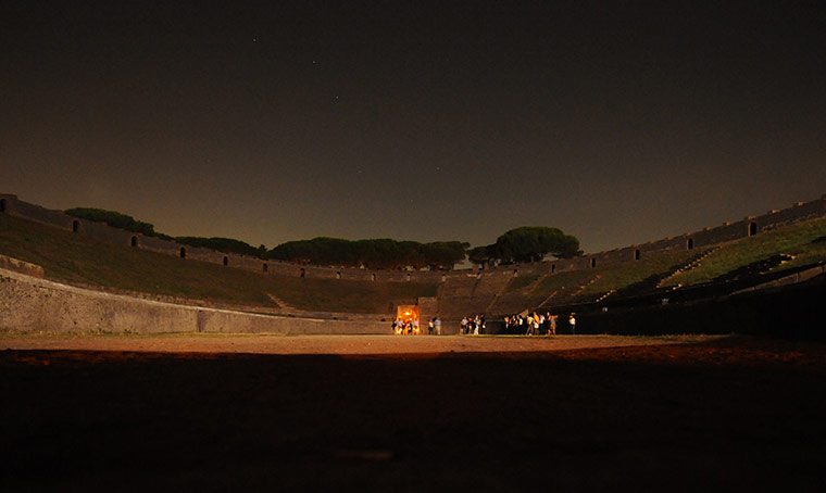 24 hours in pictures: Visitors are shown around the ancient amphiteatre in Pompeii at night