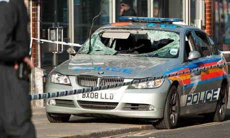 A damaged police vehicle is pictured in Enfield, north London