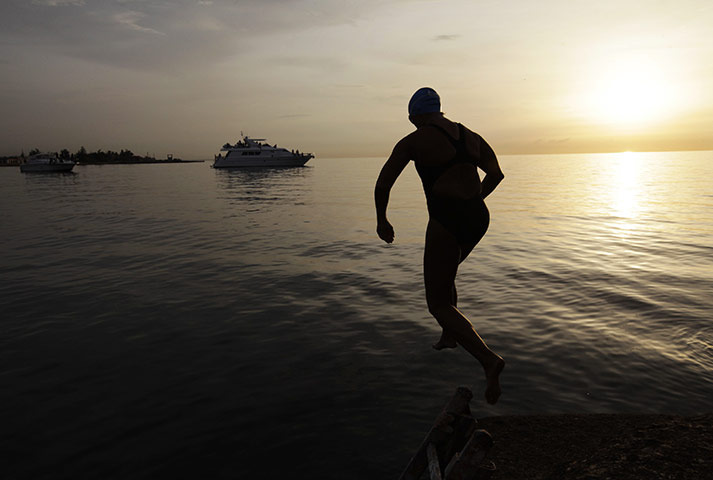 24 hours in pictures: U.S swimmer Diana Nyad jumps into the Straits of Florida in Havana