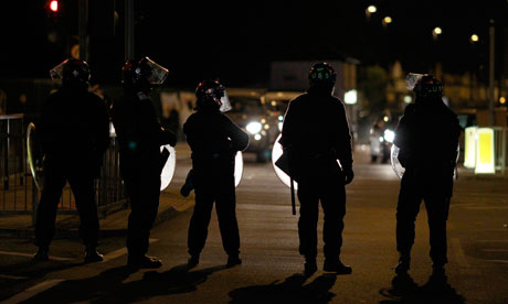 Police in riot gear in Enfield, north London, on Sunday night