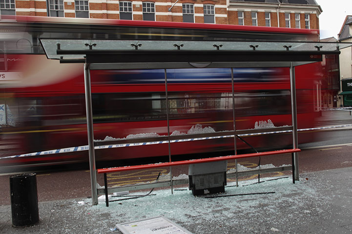 London Riots: A smashed bus shelter in Brixton 