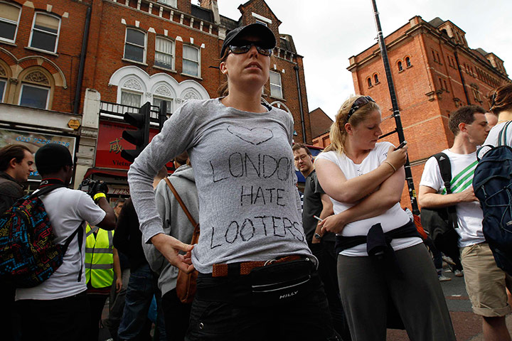 London riots day 4: Volunteers wait to clearup after riots in Clapham Junction