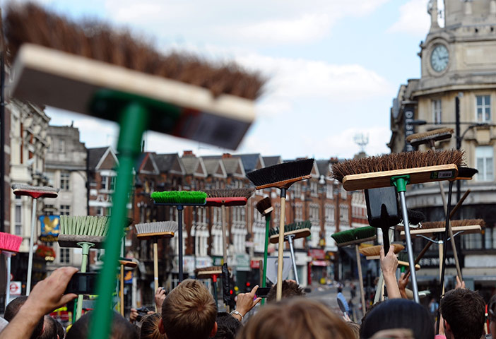 London riots day 4: Members of the public raise their brooms to Boris Johnson, Clapham Junction