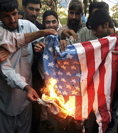 10 best: Activists of Muttahida Majlis-e-Amal burn a US flag 