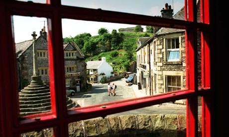 Bonsall Village seen through a phone-box door
