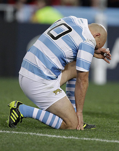 Argentina v England : Felipe Contepomi reacts to his injury