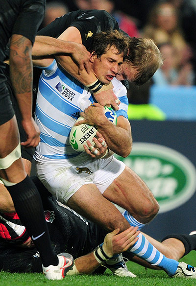 Argentina v England 2: Gonzalo Camacho is tackled 