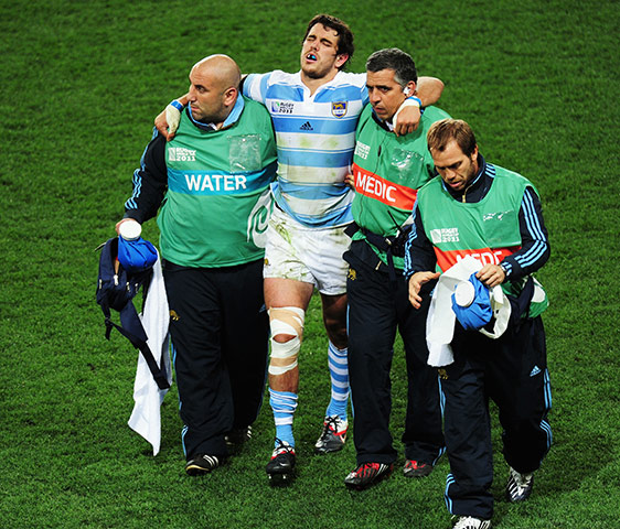 Argentina v England 2: Gonzalo Tiesi leaves the pitch after being tackled by Courtney Lawes