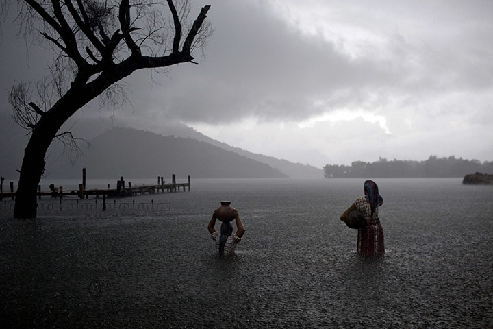 24 Hours: Sculptures of Mayan women are partially submerged in floodwaters