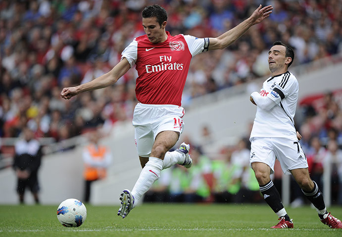 Arsenal v Swansea: Robin Van Persie streaks past Swansea's Leon Britton and fires in a shot