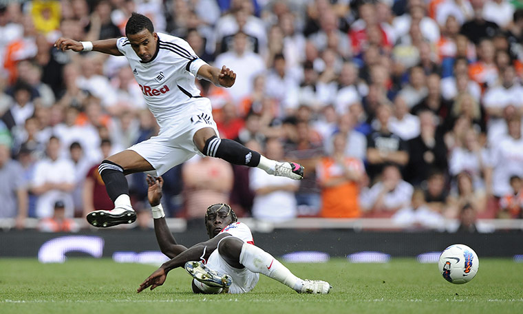 Arsenal v Swansea: Sagna tackles Sinclair