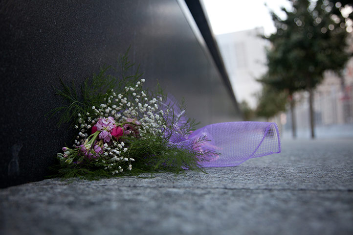 9/11 anniversary: Flowers lie at the base of the South Reflecting Pool 