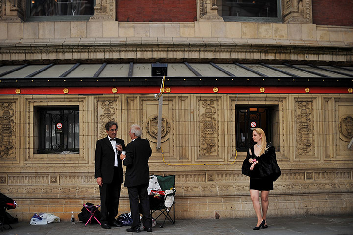 Last night of the Proms: Revellers wait in line to get into the Royal Albert Hall