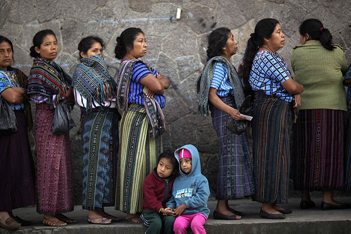 24 hours: Santiago Atitlan, Guatemala: Women wait in line to vote during elections
