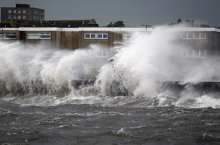windy britain: Waves hit the sea front wall at Saltcoats harbour 