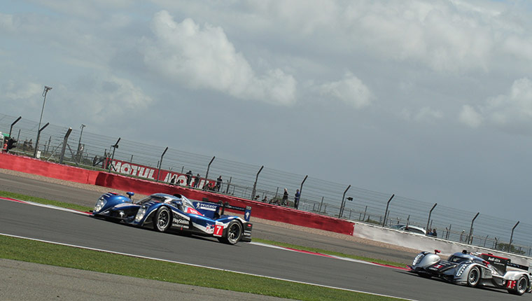 Le Mans at Silverstone: The #7 Peugeot and #1 Audi battle it out at Silverstone