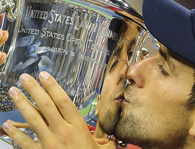 US Open final: Novak Djokovic kisses the US Open trophy after defeating Rafael Nadal 