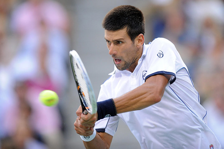 US Open final: Novak Djokovic powers a backhand return to Rafael Nadal