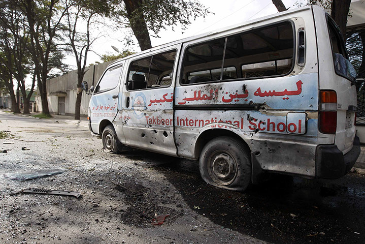 Kabul embassy attacks: A damaged vehicle is seen after a rocket-propelled grenade attack in Kabul