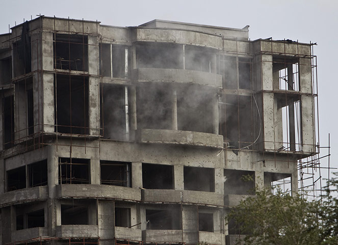Kabul embassy attacks: Dust and smoke billows from the building 