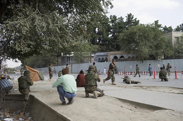 kabul seige: Afghan military personnel take cover during the seige