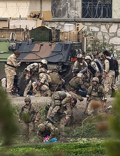 kabul seige: NATO and Afghan troops attend to injured comrades