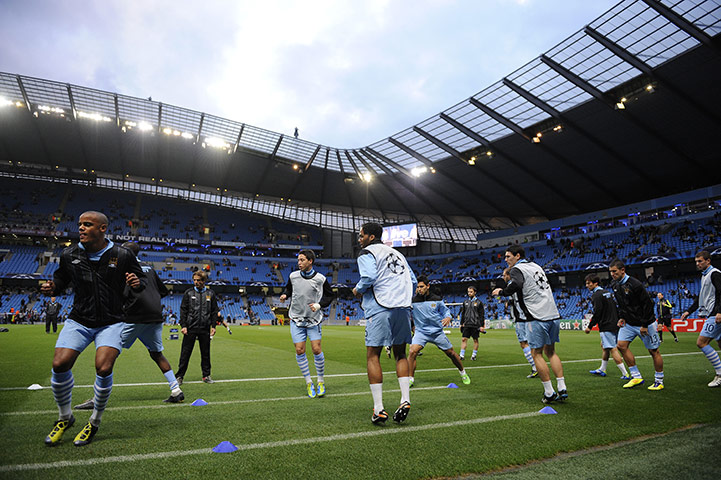 Manchester City v Napoli: Manchester City players warm up ahead of their match against Napoli