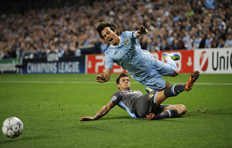 Manchester City v Napoli: David Silva is fouled by Christian Maggio 