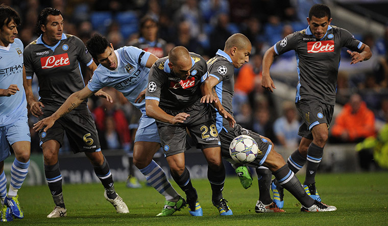 Manchester City v Napoli: Sergia Aguero finds his path is blocked by Cannavaro and Inler.