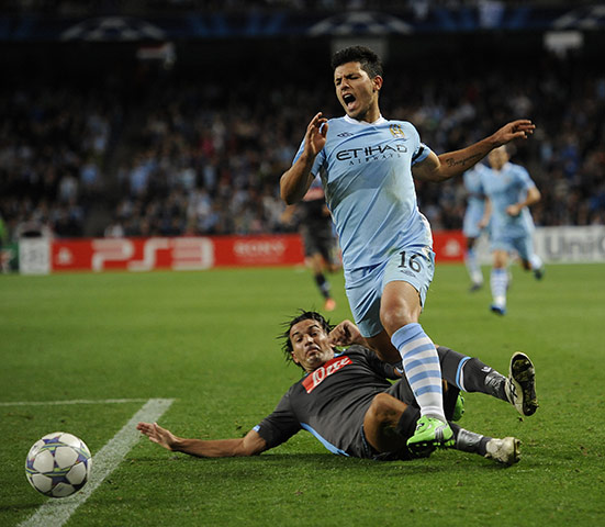 Manchester City v Napoli: Aguero yelps out after he's fouled by Aronica