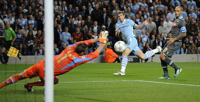Manchester City v Napoli: Manchester City's Dzeko drives a powerful low shot towards the Napoli goal