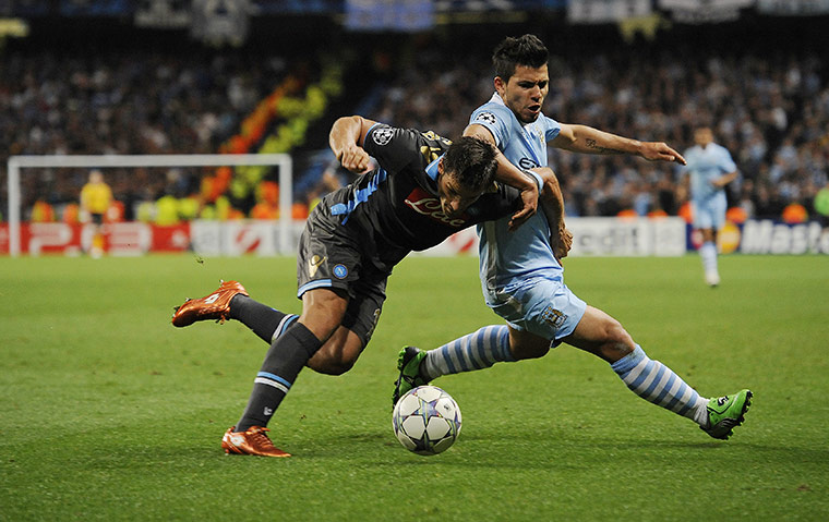 Manchester City v Napoli: Manchester City's Sergio Aguero is out muscled by Napoli's Christian Maggio