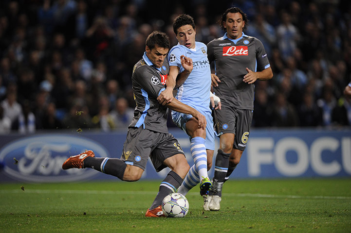 Manchester City v Napoli: Manchester City's Nasri is beaten to the ball by Napoli's Maggio