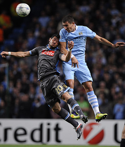 Manchester City v Napoli: Man City's Kolarov rises highest and beats Napoli's Dzemaili to a header
