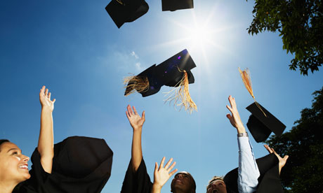 graduates throwing mortar boards